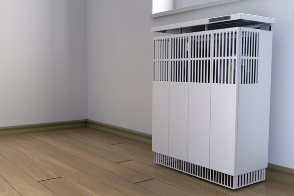 Alt="Moderner Luftreiniger mit vertikalen Lamellen, auf Holzfußboden vor weißer Wand platziert, symbolisiert intelligente Gebäudetechnik und energiesparende Lösungen für TGA-Planer und Ingenieure in der Digitalisierung von Raumluftsystemen. - © Source Of Yours - stock.adobe.com